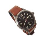 Gent's Tudor Geneve wristwatch , black face with luminous hands and indices, brown leather strap,