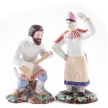 Two Russian Gardner porcelain figures, modelled as a Balalaika player, and female dancer, 'Tapahepz'