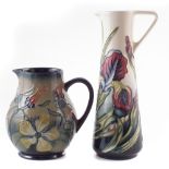 Moorcroft ewer and a jug, decorated with Iris and Hypericum patterns after Rachel Bishop, the ewer