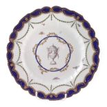 Chelsea Derby plate circa 1770 , painted with a vase of flowers within blue and gilt border, 23cm
