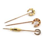 Three yellow gold horse-shoe stick pins, comprising one set with 7 small old cut diamonds, 14mm x