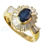 Sapphire and diamond oval cluster 18ct yellow ring with diamond set shoulders , sapphire measuring