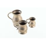 Three Georgian graduated ballaster form pewter tankards. 1 pint, 1/2 pint and 1/4 pint. For a