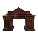 Victorian figured mahogany twin pedestal sideboard, the shaped back above inverted breakfront top,