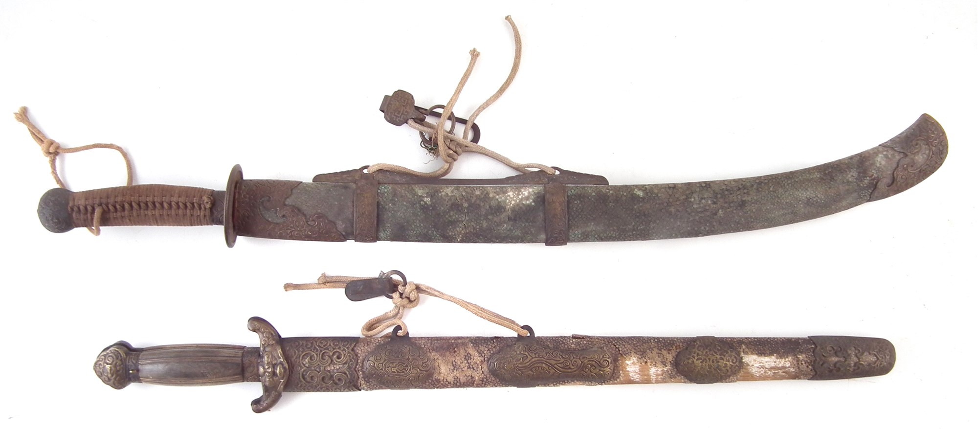 Chinese butterfly sword set, with horn grips, bronze guard modelled with a dog mask, contained