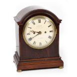 A mid 19th century mantle clock by E. White, 19 Jermyn St. London. The curved pediment sits above