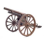 A model of artillery gun, with painted cast iron frame and brass barrel, 35cm long