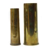 Two WWI brass shell cases, the largest measures 23cm high.