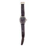 Omega military manual wind wrist watch, black face with Arabic numerals, luminous hand and baton