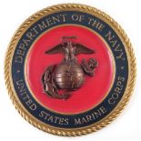 United States Marine Corps wall plaque, painted plaster, 39cm diameter