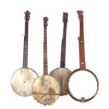 Four five string banjos , one fret less, the largest measures 96cm.