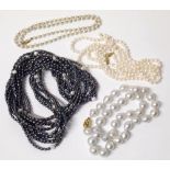 Collection of four cultured pearl necklaces, three with 9ct gold clasps or beads. Conditions reports