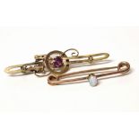 Two Victorian 9ct gold brooches, one set with garnet and seed pearl, the other with small opal.