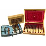 Finnigans travel case in original box, also a box containing silver fish knives and forks Conditions