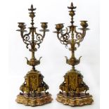 A pair of bronze column candelabras Conditions reports are not available for our Interiors Sale.