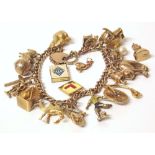 9ct yellow gold padlock charm bracelet with assorted 9ct gold charms Conditions reports are not