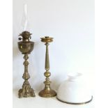 Victorian brass oil lamp with a shade and a candle stick Conditions reports are not available for