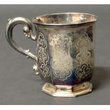 A Victorian faceted silver mug with scrolling handle, gross weight 113g, marks for Edward, Edward