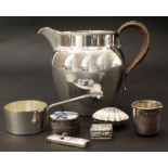 Seven items of silver plate, to include a cigar cutter, pitcher, small brandy pan, three small boxes