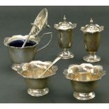 A silver cruet set by William Hutton & Sons comprising of a mustard pot with blue glass liner, two