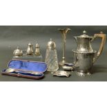 A collection of silver, to include four cruets, an ashtray, spill vase, presentation spoon, sugar