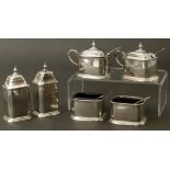 A small silver double cruet set, including two mustard pots, two pepperettes, two salts and two