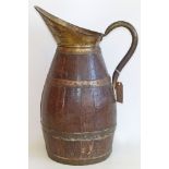 Brass bound oak jug 60cm tall Condition reports are not available for our Interiors Sale.