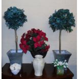 A pair of artificial bay trees, three flowers and an urn etc Condition reports are not available for