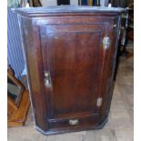 George III oak corner cupboard with 'H' brass hinges. Condition reports are not available for our