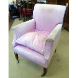 19th century sprung and upholstered fireside chair on tapered legs complete with brass castors
