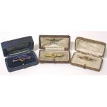 Three Victorian bar brooches, including one 9ct garnet and seed pearl brooch, a 9ct brooch with