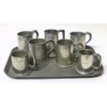 Seven pewter tankards of varying designs. Condition reports are not available for our Interiors