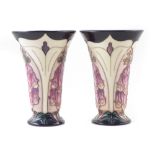 Pair of Moorcroft vases, decorated with foxgloves pattern after Rachel Bishop, one with box, (2)