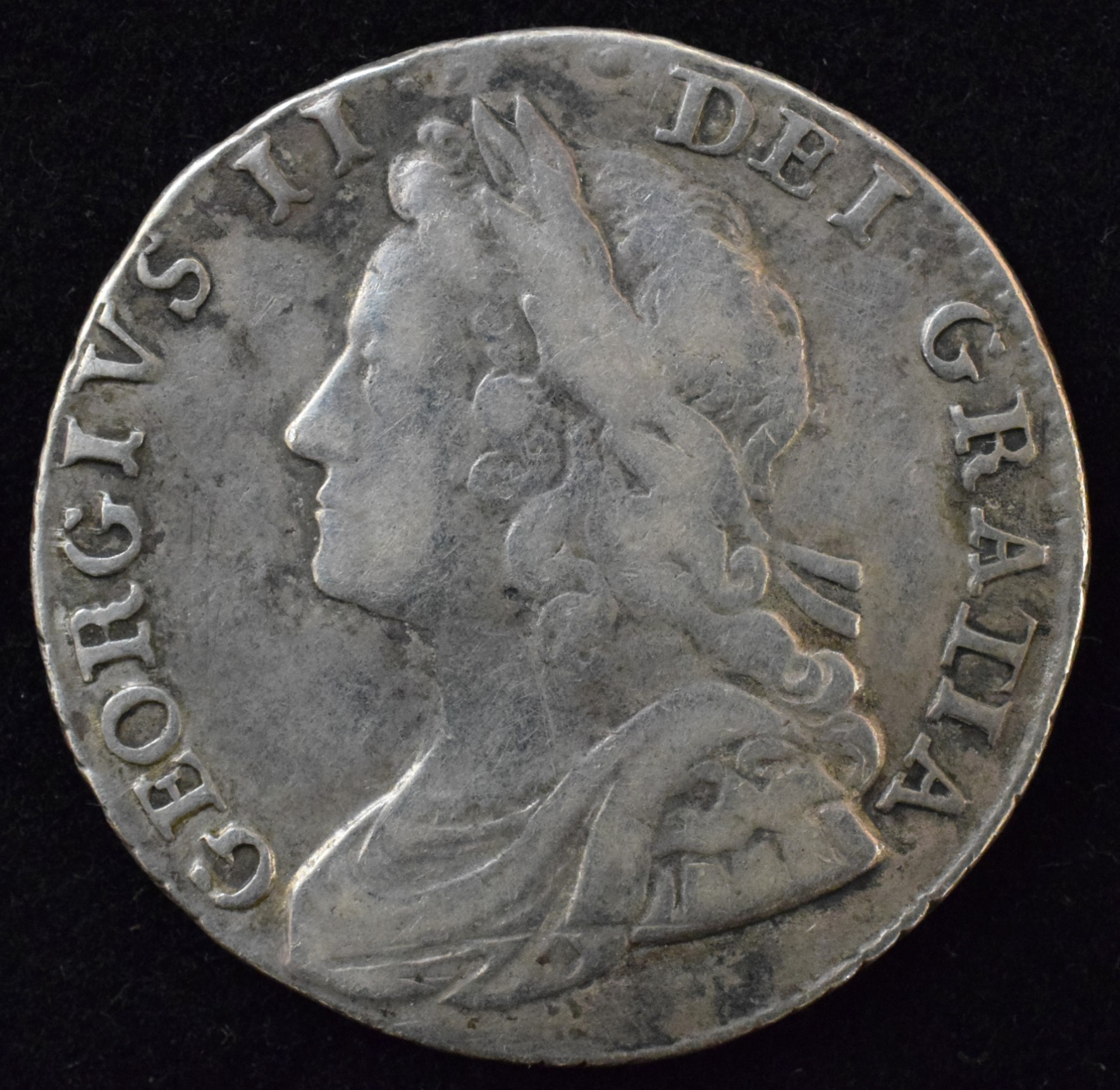 King George II, Shilling, 1734, Young laureate and draped bust l. R. Roses and plumes in angles,