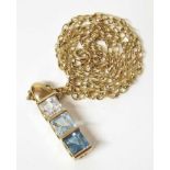 Topaz three stone 9ct gold pendant and chain Condition reports are not available for our Interiors