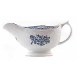 Lowestoft sauceboat circa 1775, printed with flora in underglaze blue, 20cm wide For a condition