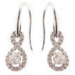 Pair of diamond 18ct white gold drop earrings , the two central brilliant cut diamonds with infinity