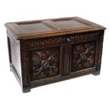 17th century oak coffer, two panelled lid with wire hinges, front with two carved panels,