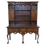 George III design, 20th century oak dresser, pierced frieze with three fixed central shelves flanked