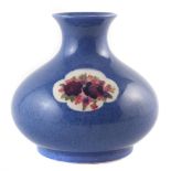 Moorcroft vase, decorated with roses on a powder blue ground 17.5cm high For a condition report