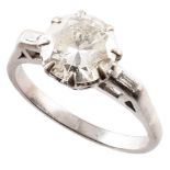 Diamond solitaire platinum ring with diamond set shoulders , round brilliant cut diamond weighing