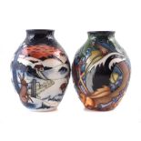 Two small Moorcroft vases one decorated with badgers the other with hares in a winter landscape (