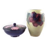 Moorcroft vase and lidded bowl, decorated with magnolia and hibiscus patterns (3) the vase stands