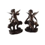 A pair of late 19th century French bronze cherubs. One plays a horn the other plays the snare