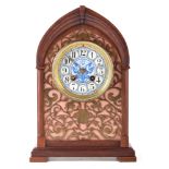 A 19th century mantle clock by Henri Marc of Paris. The oak case has lancet arch with stepped