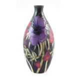 Moorcroft Anemone pattern vase, 23cm high For a condition report please visit our website www.