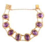Edwardian amethyst set 9ct gold bracelet , total of 8 oval mixed cut amethysts measuring approx.