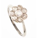 Diamond flower head cluster platinum ring , central old cut diamond with a surround of 7 old cut