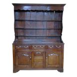 Late 18th century oak Welsh dresser, shaped canopy with ogee mould, three fixed graduated shelves