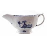 Lowestoft sauceboat circa 1770, painted with landscapes in underglaze blue, painter's mark to